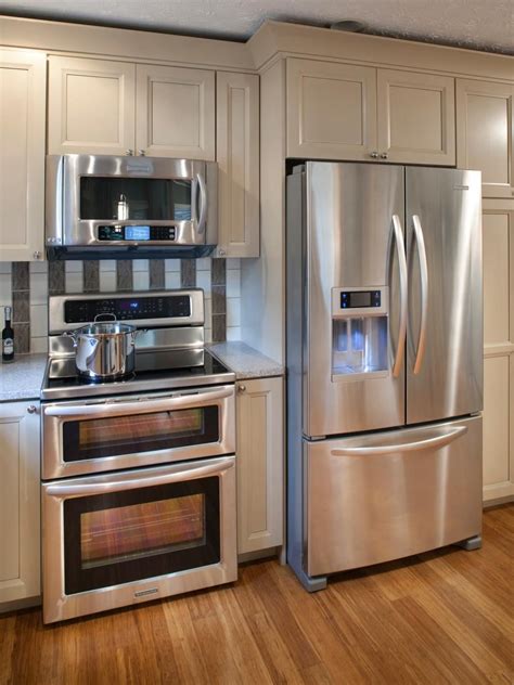 white or stainless steel with wood cabinets|kitchens with wooden refrigerator cabinets.